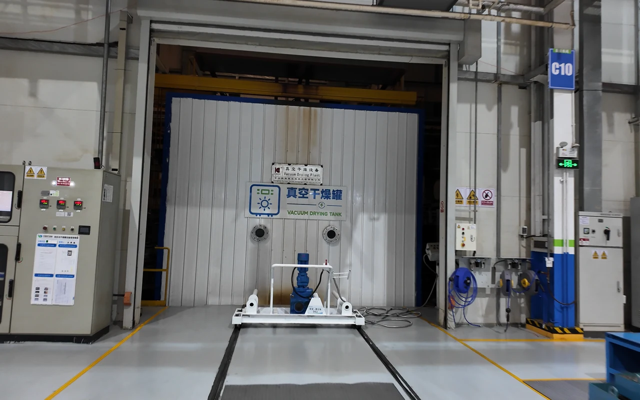 Transformer vacuum drying tank with control panels and loading rails