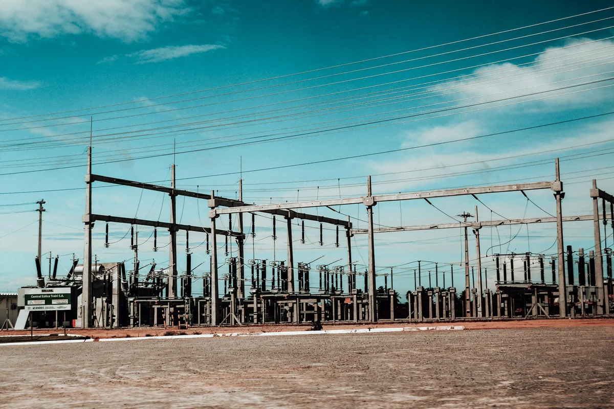 Outdoor electrical substation with transformers, switchgear and overhead power lines