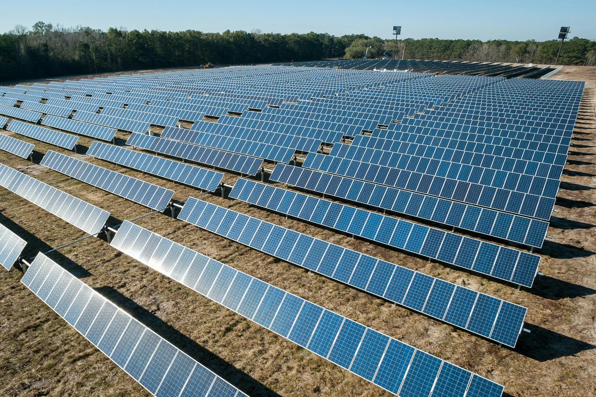 Rows of photovoltaic panels at a utility-scale solar power plant